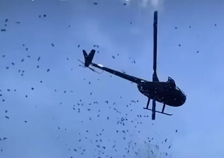 Helicopter Rains Cash and Petals Over Detroit Funeral