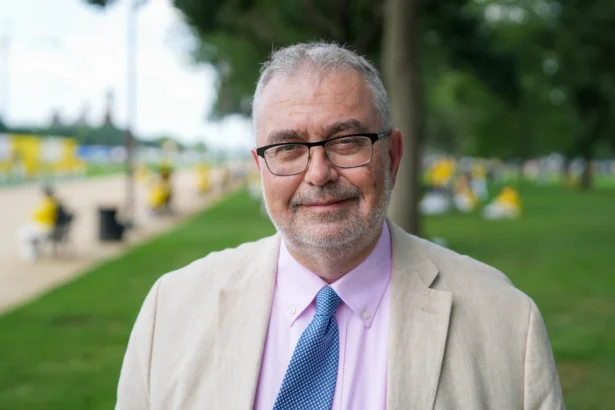 Piero Tozzi, staff director of the Congressional-Executive Commission on China attends an annual rally calling for the end of the Chinese Communist Party’s ongoing persecution of Falun Gong in China, on the National Mall in Washington on July 17, 2025. (Samira Bouaou/The Epoch Times)