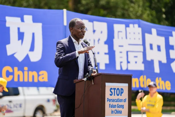 Mohamed Elsanousi, Commissioner of the United States Commission on International Religious Freedom (USCIRF), speaks during a Falun Dafa rally calling for the end of the Chinese Communist Party’s 26 years of persecution of Falun Gong in China, on the National Mall in Washington on July 17, 2025. (Madalina Kilroy/The Epoch Times)