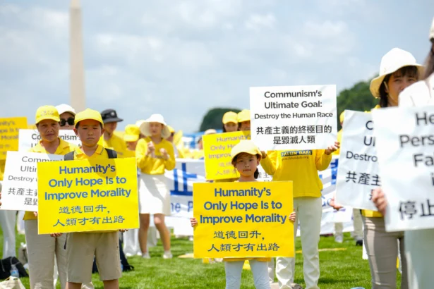 Falun Dafa practitioners gather for an annual rally calling for the end of the Chinese Communist Party’s ongoing persecution of Falun Gong in China, on the National Mall in Washington on July 17, 2025. (Samira Bouaou/The Epoch Times)