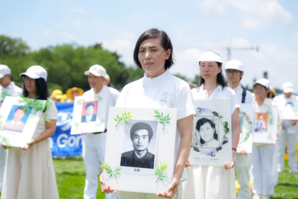 Falun Dafa practitioners gather for an annual rally calling for the end of the Chinese Communist Party’s ongoing persecution of Falun Gong in China, on the National Mall in Washington on July 17, 2025. (Samira Bouaou/The Epoch Times)