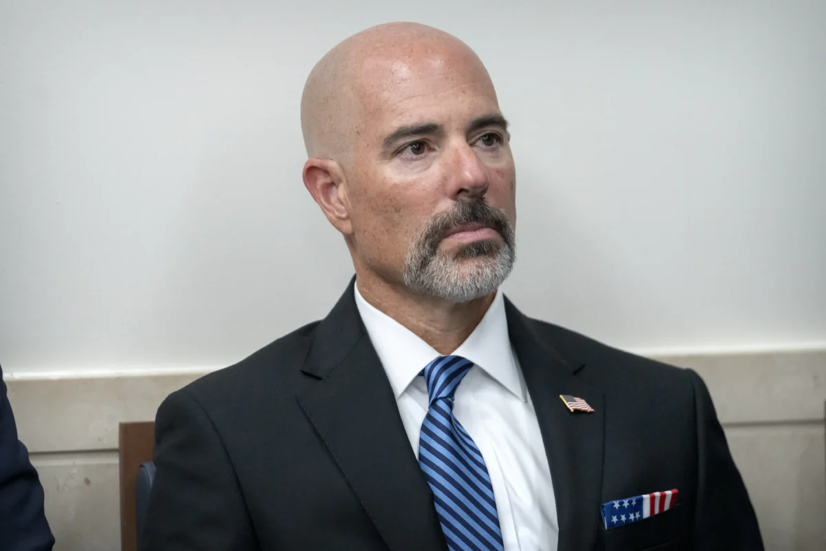 Drug Enforcement Agency Administrator Terrance Cole listens as President Donald Trump speaks with reporters in the James Brady Press Briefing Room at the White House on Aug. 11, 2025. (Mark Schiefelbein/AP Photo)