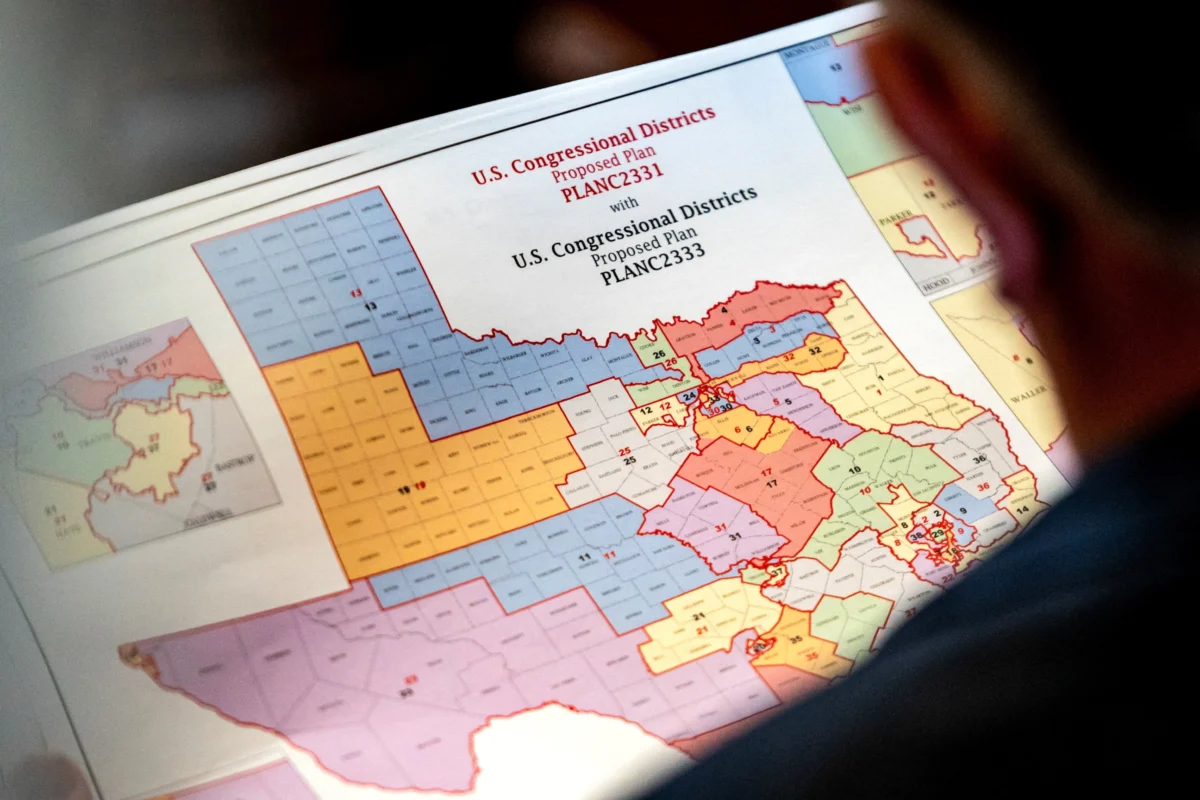 State Rep. Matt Morgan (R-Texas) holds a map of the new proposed congressional districts in Texas, during a legislative session as Democratic lawmakers, who left the state to deny Republicans the opportunity to redraw the state's 38 congressional districts, begin returning to the Texas State Capitol in Austin, Texas, on Aug. 20, 2025. (Sergio Flores/Reuters)