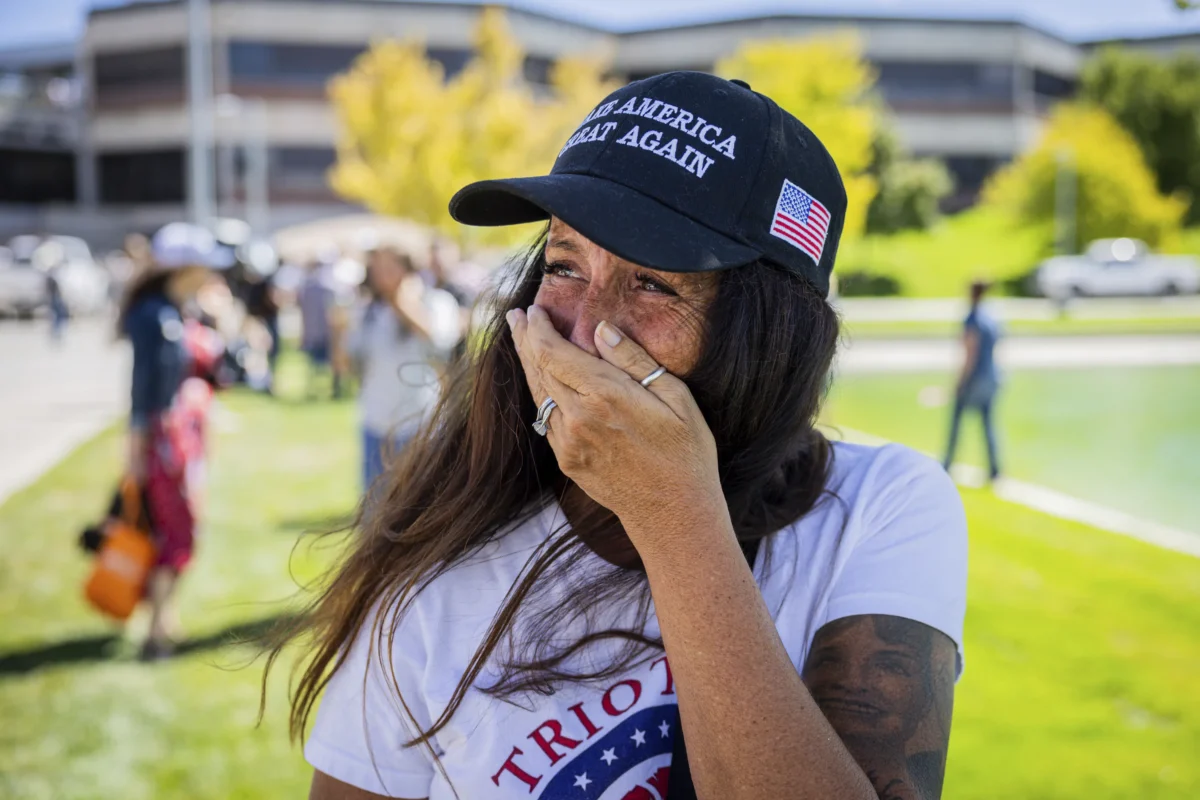 Allison Hemingway-Witty cries after Charlie Kirk is shot during Turning Point's visit to Utah Valley University in Orem, Utah, on Sept. 10, 2025. (Tess Crowley/The Deseret News via AP)