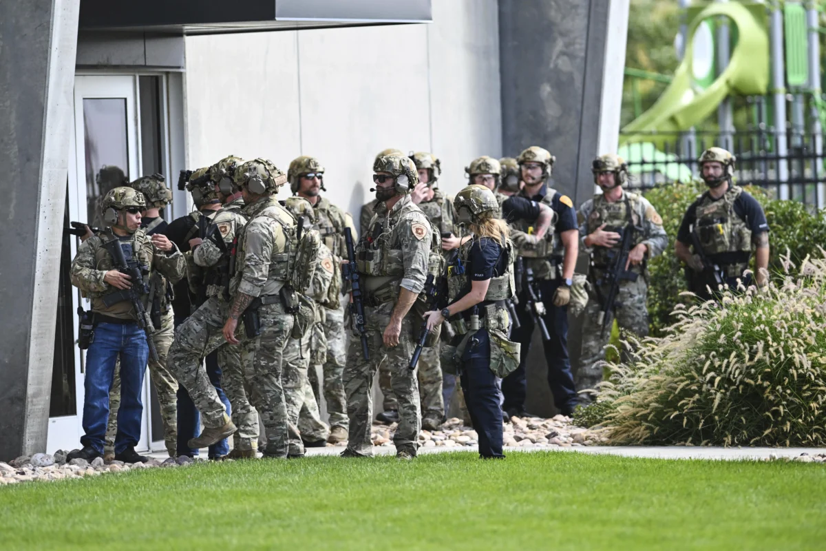 Law enforcement officials prepare to sweep a building at Utah Valley University in Orem, Utah, on Sept. 10, 2025. (Tyler Tate/AP Photo)