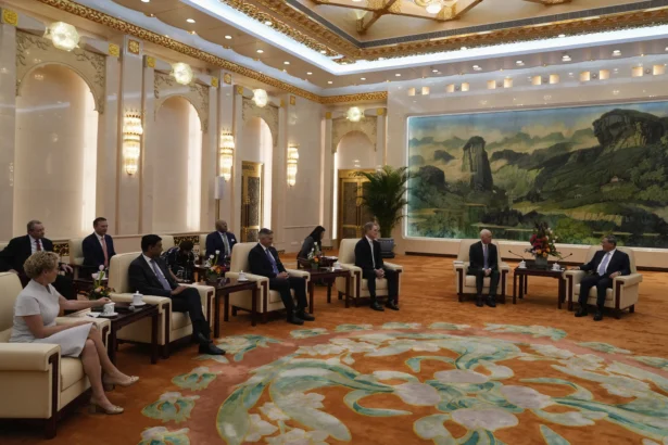 Rep. Adam Smith (D-Wash.) (2nd R) speaks with Chinese Premier Li Qiang (R) as he leads a bipartisan group of U.S. lawmakers, including (from L) Reps. Chrissy Houlahan (D-Pa.), Ro Khanna (D-Calif.), and Michael Baumgartner (R-Wash.) and U.S. Ambassador to China David Perdue, at the Great Hall of the People in Beijing on Sept. 21, 2025. (Mahesh Kumar A./Pool/AFP via Getty Images)