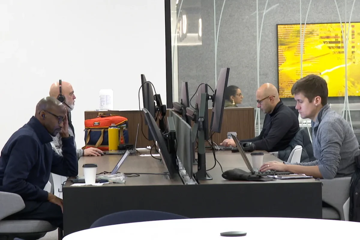 Employees work in Ford Motor Co.'s new headquarters building in Dearborn, Mich., on Nov. 10, 2025, in a still from video. (Mike Householder/AP Photo)