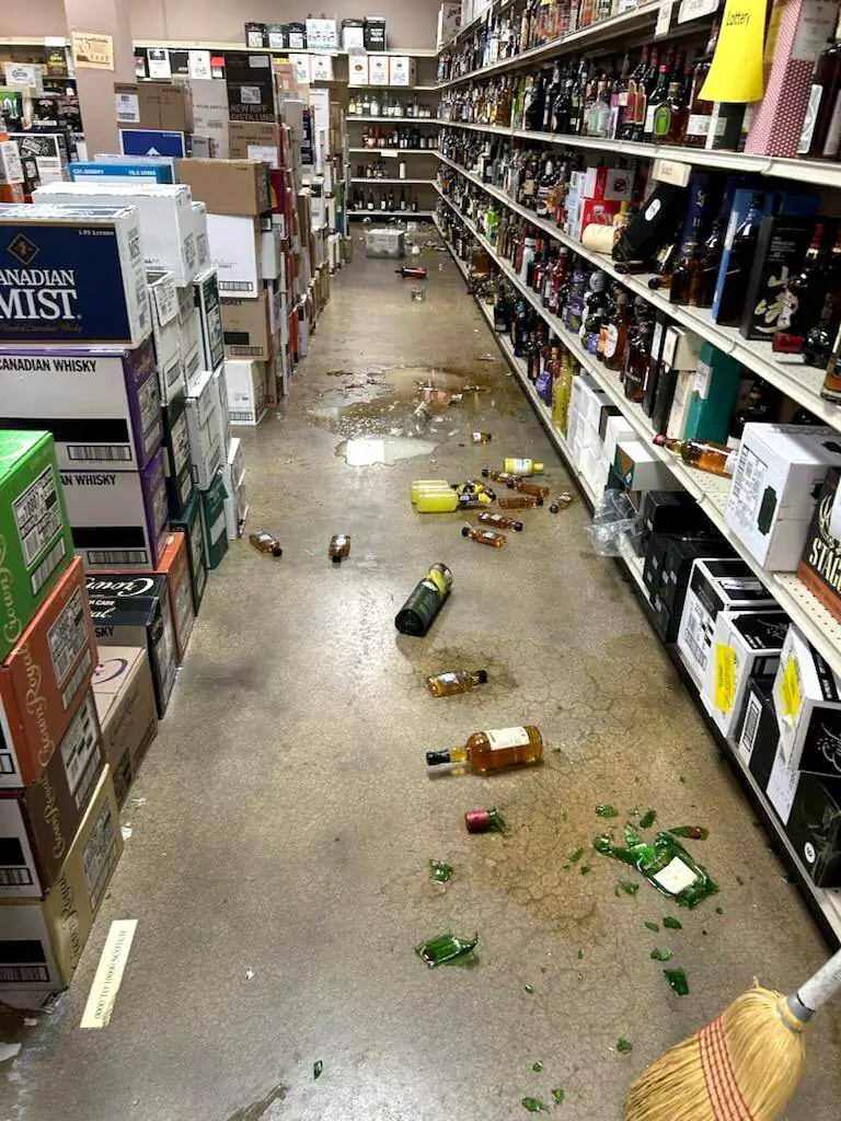 Broken bottles are seen after a raccoon enters a liquor store in Ashland, Va., on Nov. 29, 2025. (Samantha Martin/Hanover County Protection via AP)