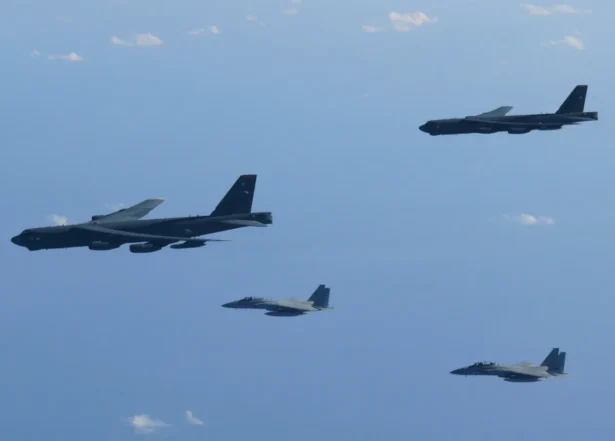 The 6th Air Wing of Japan Air Self-Defense Force’s F-15 fighters hold a joint military drill with the U.S. B-52 bombers over the Sea of Japan on Dec. 10, 2025. (Joint Staff Office of the Defense Ministry of Japan/Handout via Reuters)