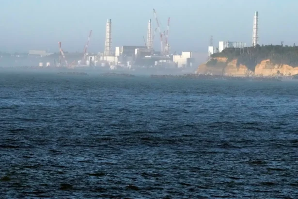 The Fukushima Daiichi nuclear power plant, damaged by a massive March 11, 2011, earthquake and tsunami, is seen from the nearby Ukedo fishing port in Namie town, northeastern Japan, on Aug. 24, 2023. (Eugene Hoshiko/AP Photo)