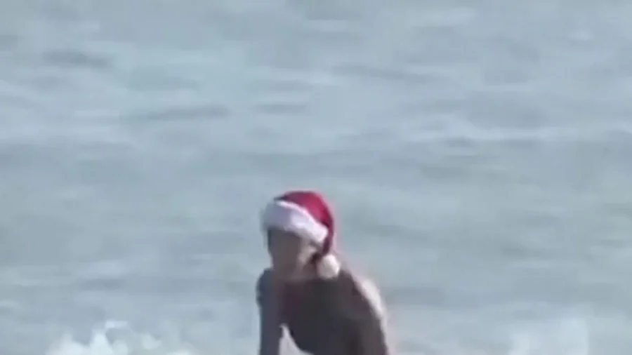 Surfers Dress as Santa Claus at Annual Florida Beach Event