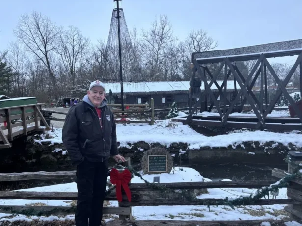 Anthony Satariano Jr. stands next to a memorial for his late father, Anthony Satariano Sr., at Clifton Mill in Ohio on Dec. 8, 2025. (Jeff Louderback/The Epoch Times)