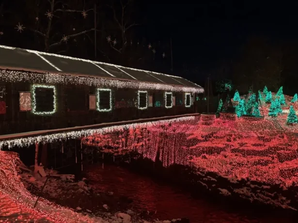 A covered bridge is adorned with Christmas lights at Clifton Mill in Ohio on Dec. 8, 2025. (Jeff Louderback/The Epoch Times)