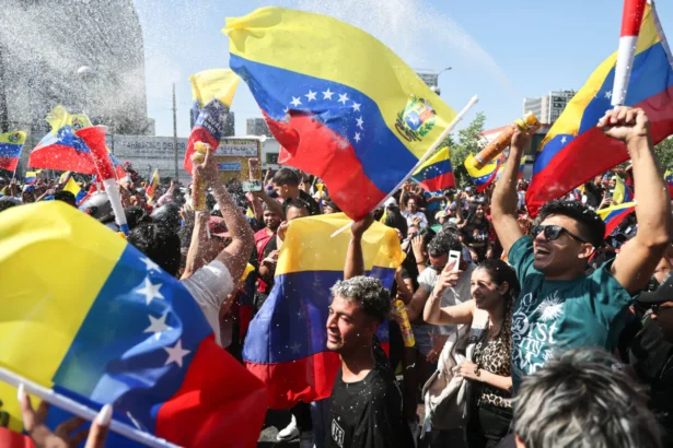 Venezuelans living in Chile celebrate in Santiago on Jan. 3, 2026, after U.S. forces captured Venezuelan leader Nicolas Maduro after launching a strike on Venezuela. (Javier Torres/AFP via Getty Images)