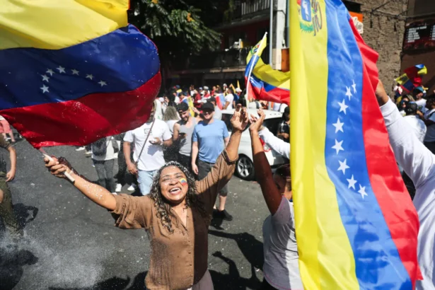 Venezuelans living in Chile celebrate in Santiago on Jan. 3, 2026, after U.S. forces captured Venezuelan leader Nicolas Maduro after launching a strike on Venezuela. (Javier Torres/AFP via Getty Images)