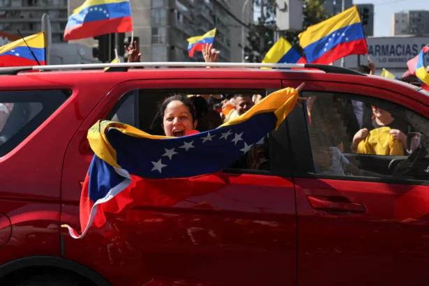 Venezuelans living in Chile celebrate in Santiago on Jan. 3, 2026, after U.S. forces captured Venezuelan leader Nicolas Maduro after launching a strike on Venezuela. (Javier Torres/AFP via Getty Images)