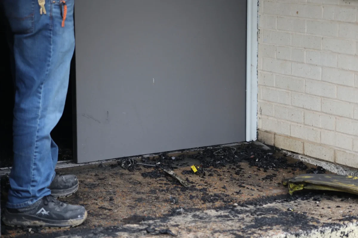 Zach Shemper, president of Beth Israel Congregation, stands in ashes outside the congregation’s temple hours after the building was damaged by fire, in Jackson, Miss., on Jan. 10, 2026. (Allen Siegler/Mississippi Today via AP)