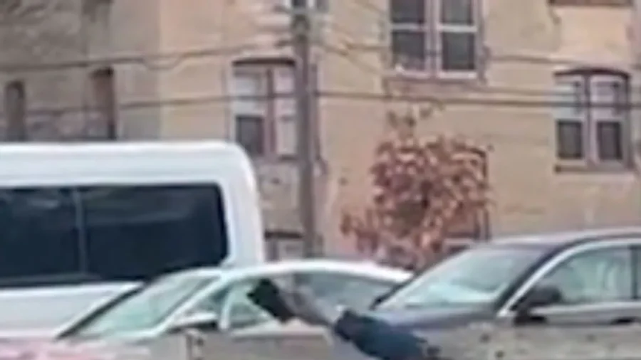 ICE Agent Pushes Man Obstructing ICE Vehicle on Minneapolis Street