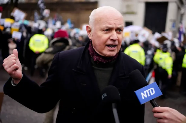 Former Conservative Party leader and current Member of Parliament Iain Duncan Smith speaks to NTD as protesters from at least 28 diasporic groups protest outside the proposed site of the new Chinese Embassy redevelopment in Royal Mint Court, central London, on Feb. 8, 2025. (Jordan Pettitt/PA)