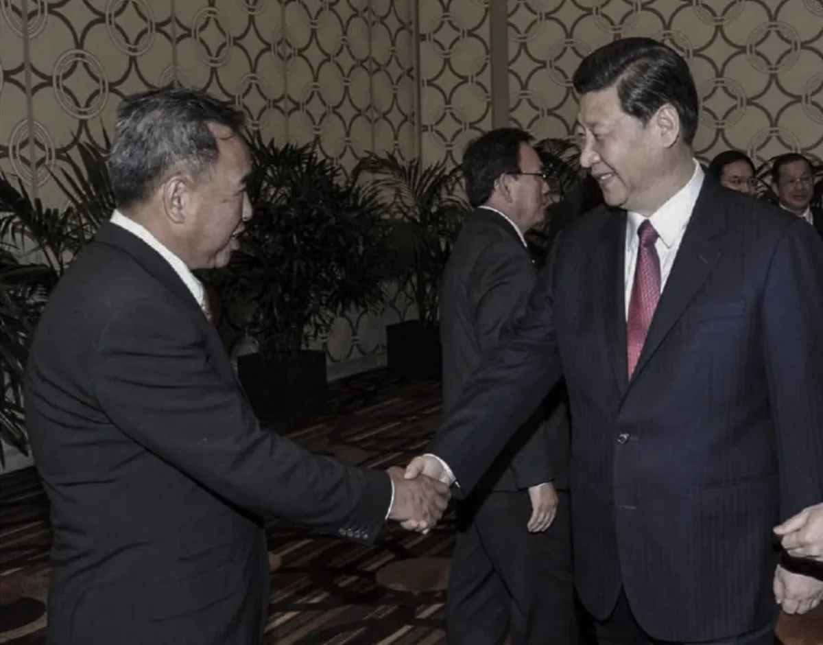 John Chen (L) meets with Chinese communist leader Xi Jinping in Beijing, China, in an undated photo. Chen was sentenced to 20 months in prison on Nov. 19, 2024 for acting as an illegal Chinese agent and bribing IRS against Falun Gong. (Department of Justice filing)