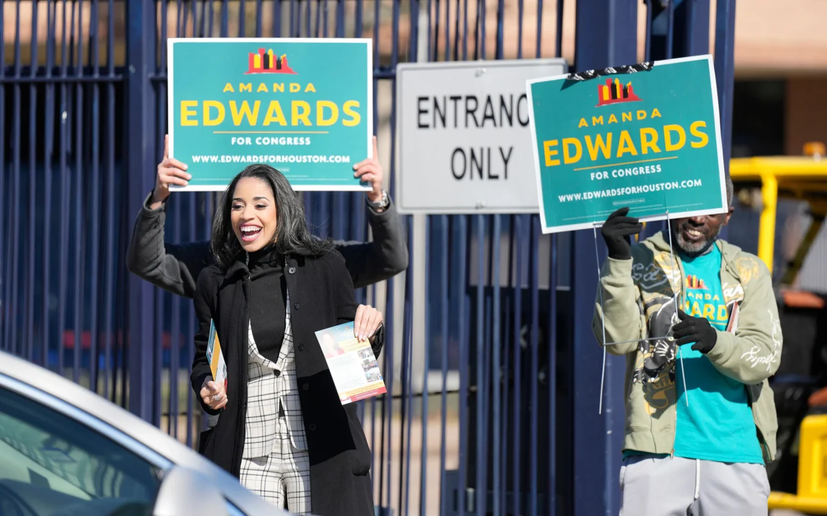 Texas Congressional Candidate Amanda Edwards waves at a voter at a polling location at Acres Homes MultiService Center on Election Day, in Houston, on an. 31, 2026. (Karen Warren/AP Photo)