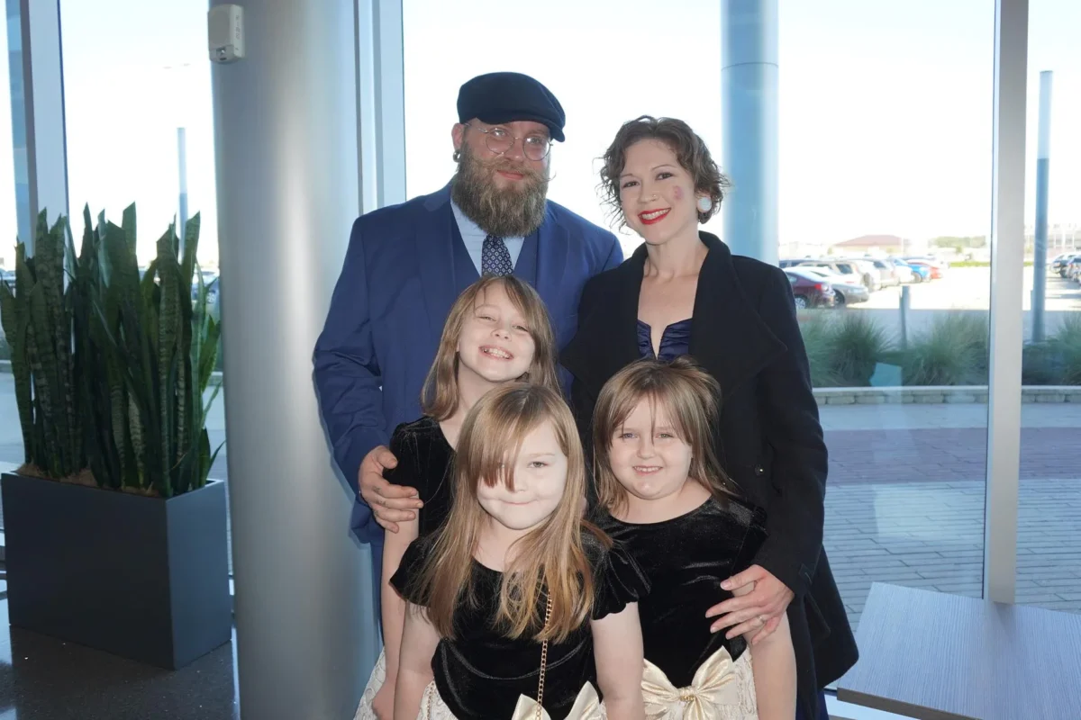 Blake Hanson stands with his wife and three daughters in the lobby of the CFISD Visual and Performing Arts Center in Houston after seeing Shen Yun Performing Arts on Jan. 31, 2026. (Sally Sun/The Epoch Times)