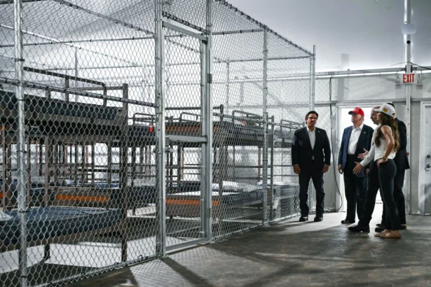 President President Donald Trump (2L), Florida Gov. Ron DeSantis (L), and then-Secretary of Homeland Security Kristi Noem (R) tour a detention center for illegal immigrants, dubbed Alligator Alcatraz, located at the site of the Dade-Collier Training and Transition Airport in Ochopee, Fla., on July 1, 2025. (Andrew Caballero-Reynolds/AFP via Getty Images)