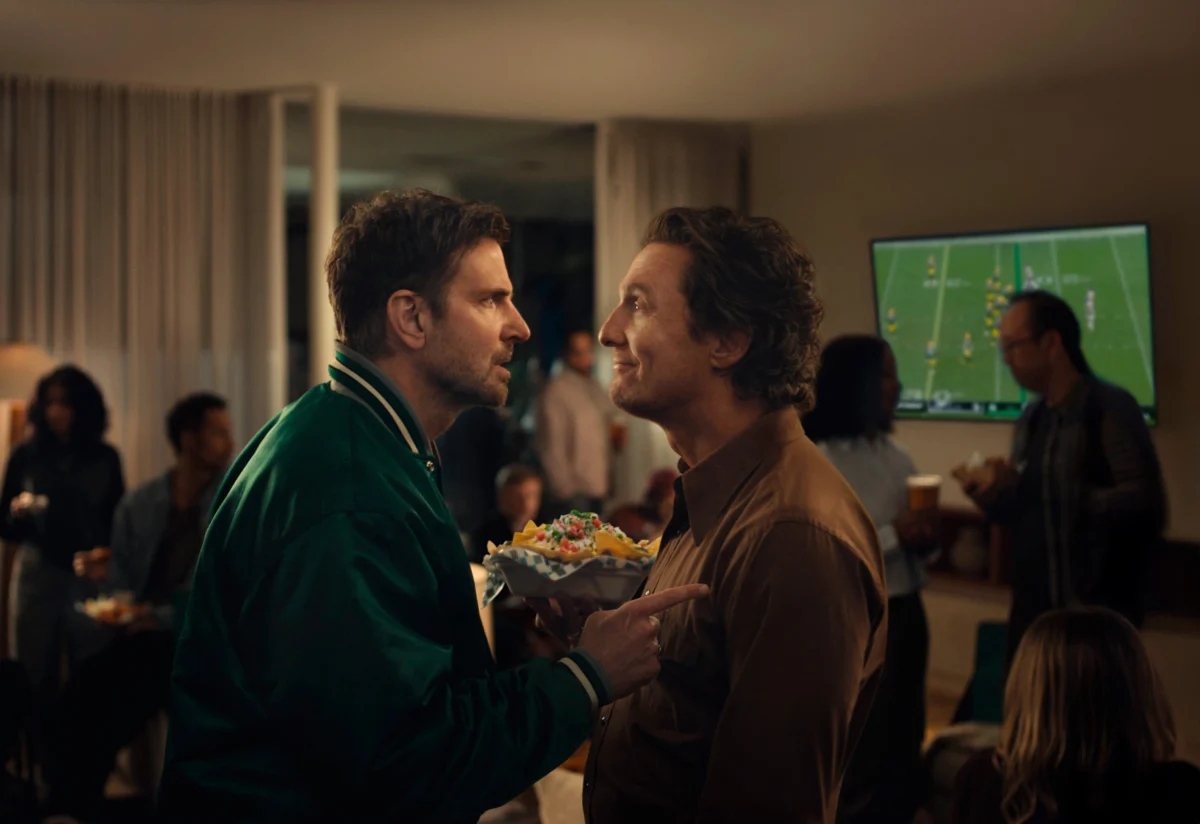 Bradley Cooper (L) and Matthew McConaughey in a scene from the Uber Eats 2026 Super Bowl NFL football spot. (Uber Eats via AP)