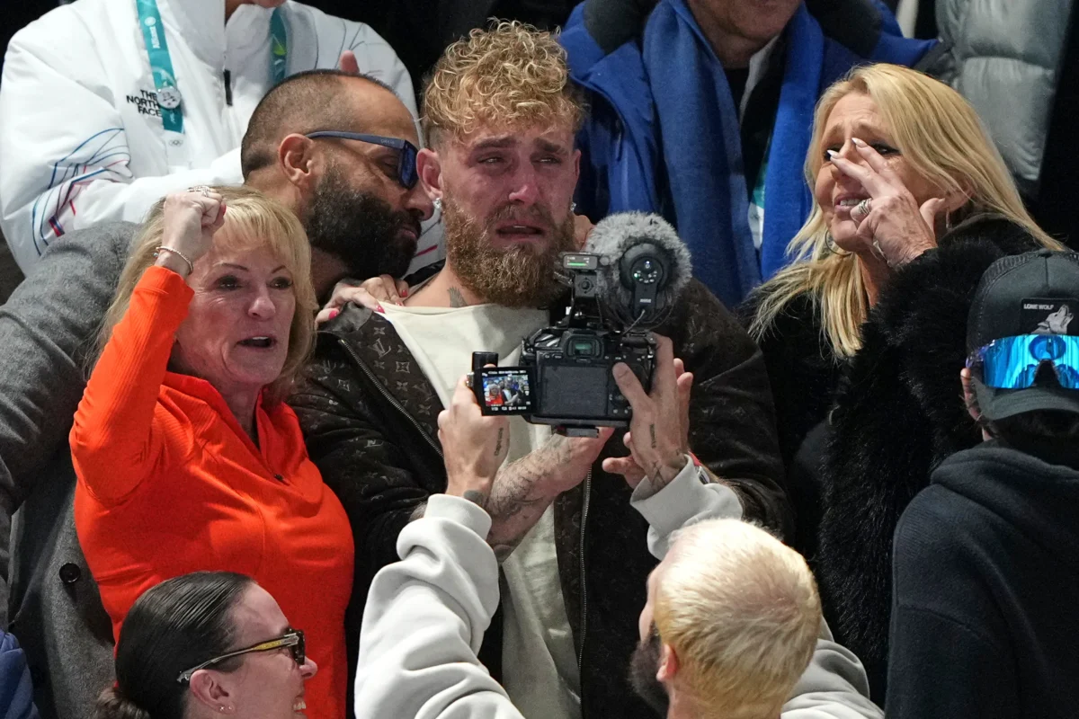 Jake Paul (C) cries after his fiancé Jutta Leerdam of the Netherlands won the gold medal in the women's 1,000 meters speedskating race at the 2026 Winter Olympics, in Milan, Italy, on Feb. 9, 2026. (Antonio Calanni/AP Photo)