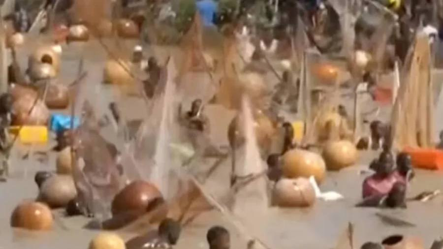 Hundreds Rush Into Nigerian River for Fishing Festival Finale