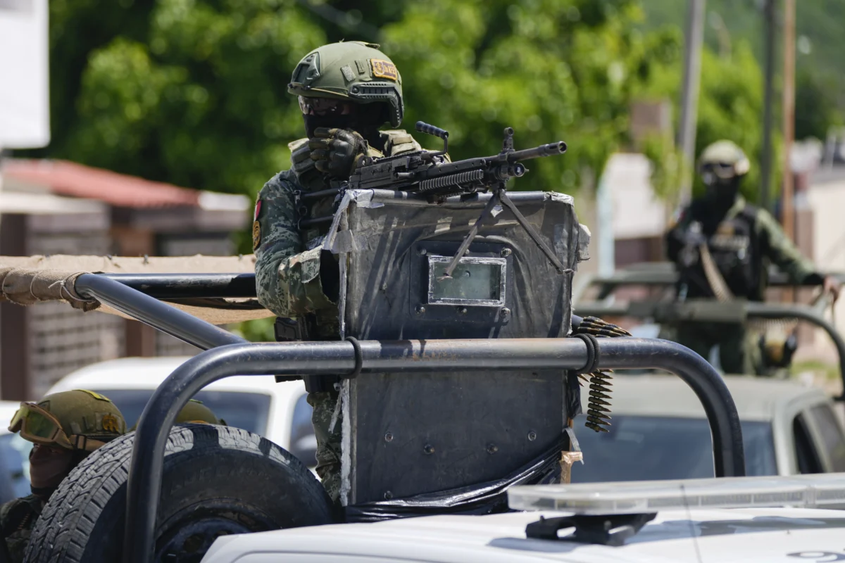 National Guard and Army forces patrol during an operation in a neighborhood of Culiacan, Sinaloa state, Mexico, Thursday, Sept. 19, 2024. (AP Photo/Eduardo Verdugo)