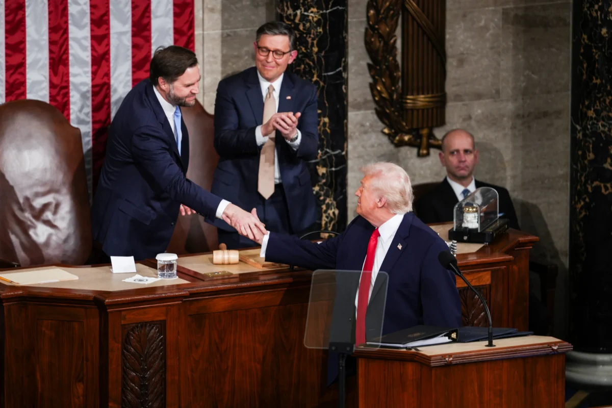 Vice President JD Vance (L) shakes hands with President Donald Trump at his first State of the Union address during his second presidential term, in the House Chamber on Capitol Hill in Washington on Feb. 24, 2026. (Madalina Kilroy/The Epoch Times)
