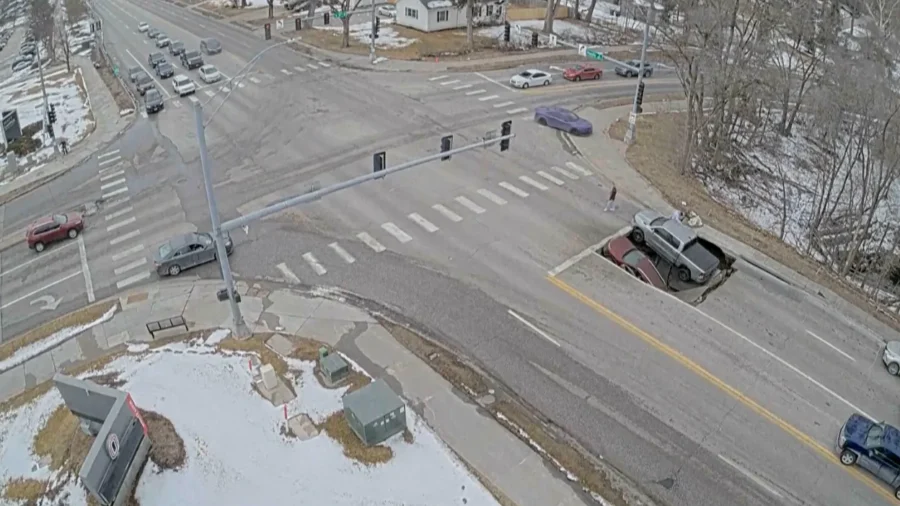 Sinkhole Opens at Omaha Intersection, Swallowing SUV and Pickup Truck