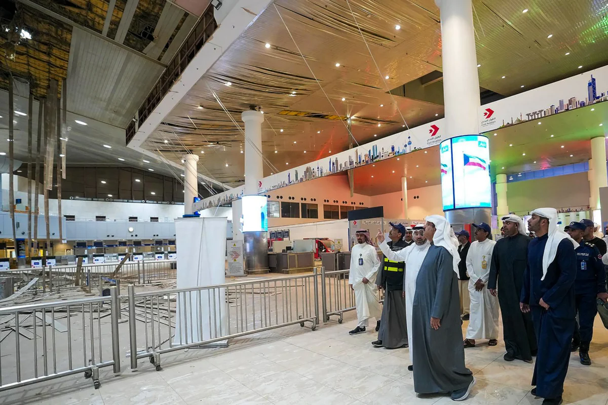Kuwaiti Prime Minister Sheikh Ahmad al-Abdullah al-Sabah (C) visits the international airport after it was hit by a reported Iranian strike in Kuwait City on March 1, 2026. (Kuna/AFP via Getty Images)