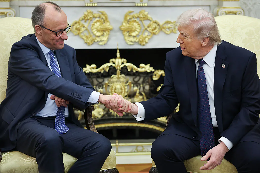 U.S. President Donald Trump shakes hands with German Chancellor Friedrich Merz (L) in the Oval Office of the White House on March 3, 2026. (Win McNamee/Getty Images)