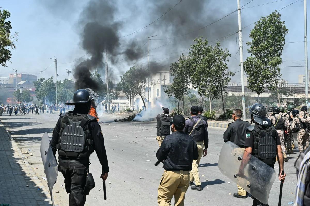 Police fire tear gas at Shiite Muslims as they stage protests in solidarity with the Iranian regime, outside the U.S. consulate in Karachi, Pakistan, on March 1, 2026. (Asif Hassan/AFP via Getty Images)