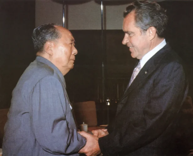 Chinese communist leader Chairman Mao Zedong (L) greets U.S. President Richard Nixon at his house in Beijing on Feb. 21, 1972. (AFP via Getty Images)