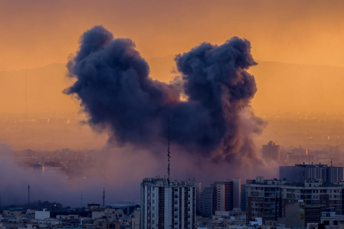 A plume of smoke rises after a strike on the Iranian capital Tehran, on March 3, 2026. (Atta Kenare/AFP via Getty Images)