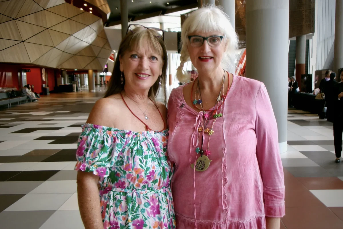 Cheryl Graham (L) attends Shen Yun Performing Arts with one of her meditation students at the Melbourne Convention and Exhibition Centre in Australia on March 15, 2026. (Terri Wu/The Epoch Times)
