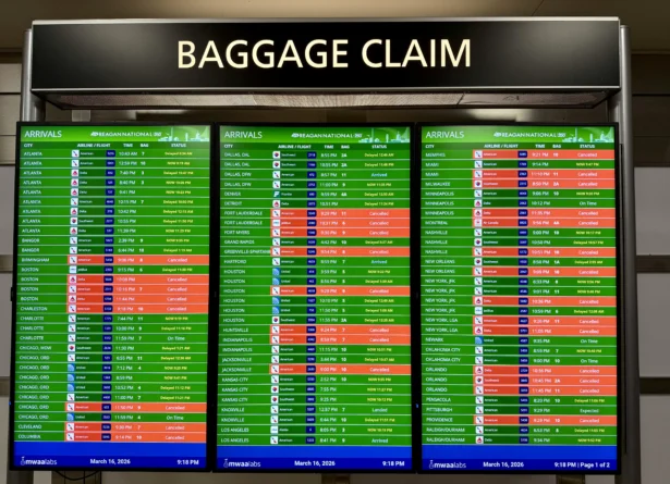 The arrivals board displaying multiple canceled and delayed flights is shown at Ronald Reagan Washington National Airport in Arlington, Va., on March 16, 2026. (Daniel Slim/AFP via Getty Images)