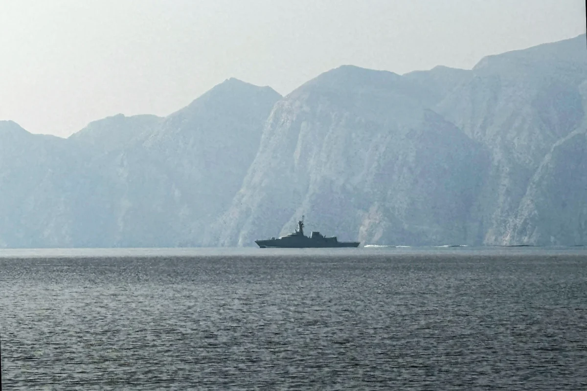 A navy vessel is seen sailing in the Strait of Hormuz, a vital waterway through which much of the world's oil and gas passes on March 1, 2026. (Sahar Al Attar/AFP via Getty Images)