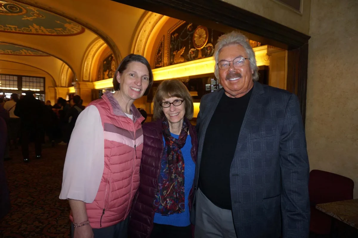 Carsten Ellison (R) watches Shen Yun Performing Arts at the Orpheum Theatre in Minneapolis, Minn., on March 28, 2026. (Yeawen Hung/The Epoch Times)
