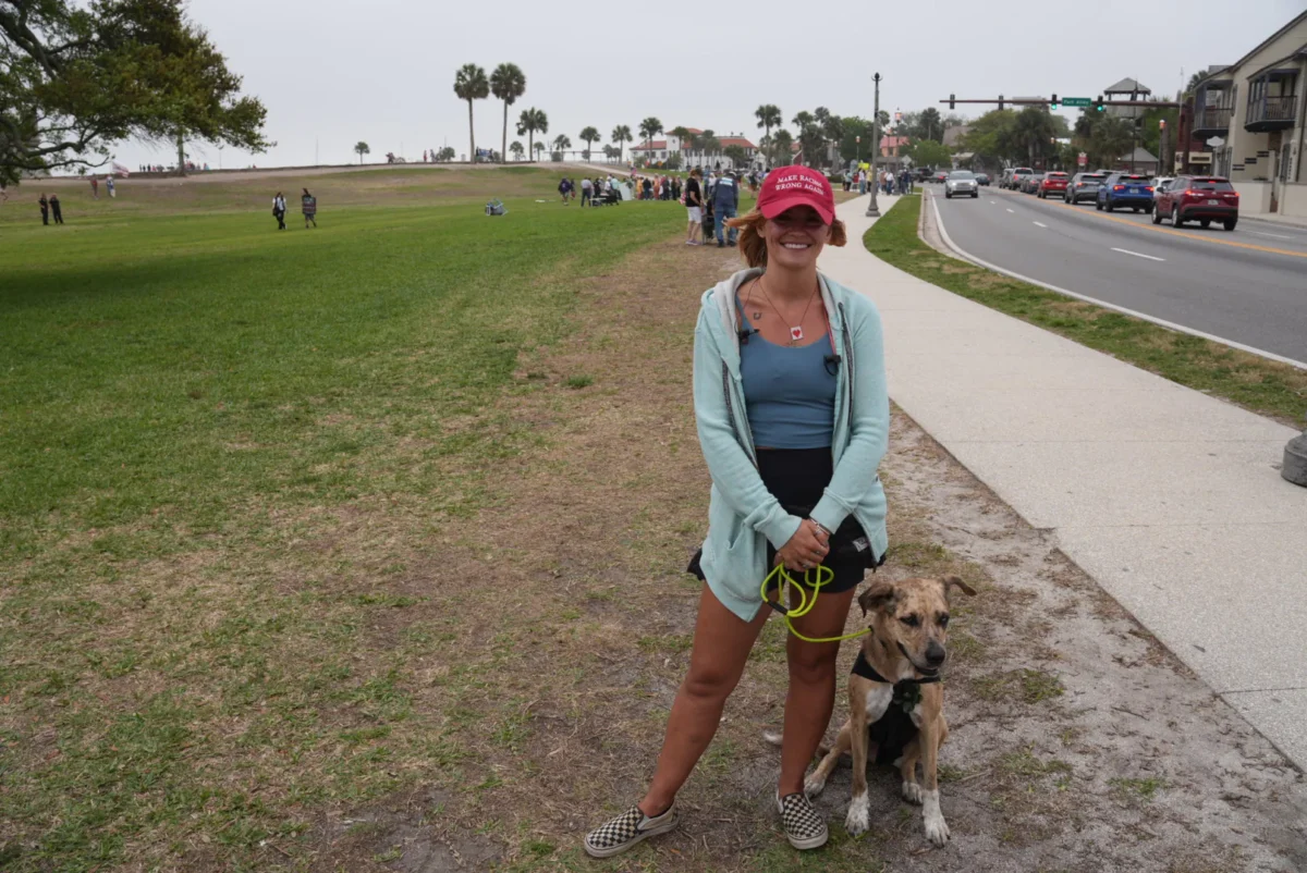 Elyssa Male and her dog, Lilo, attended a "No Kings" protest in St. Augustine, Fla., on March 28, 2026. (Troy Myers/The Epoch Times)