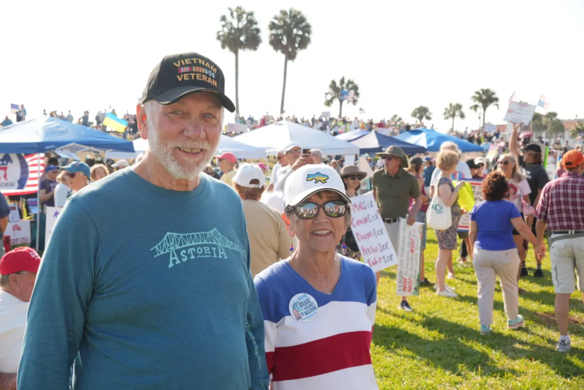 Kent Olsen and his wife attended a "No Kings" protest in St. Augustine, Fla., on March 28, 2026. (Troy Myers/The Epoch Times)