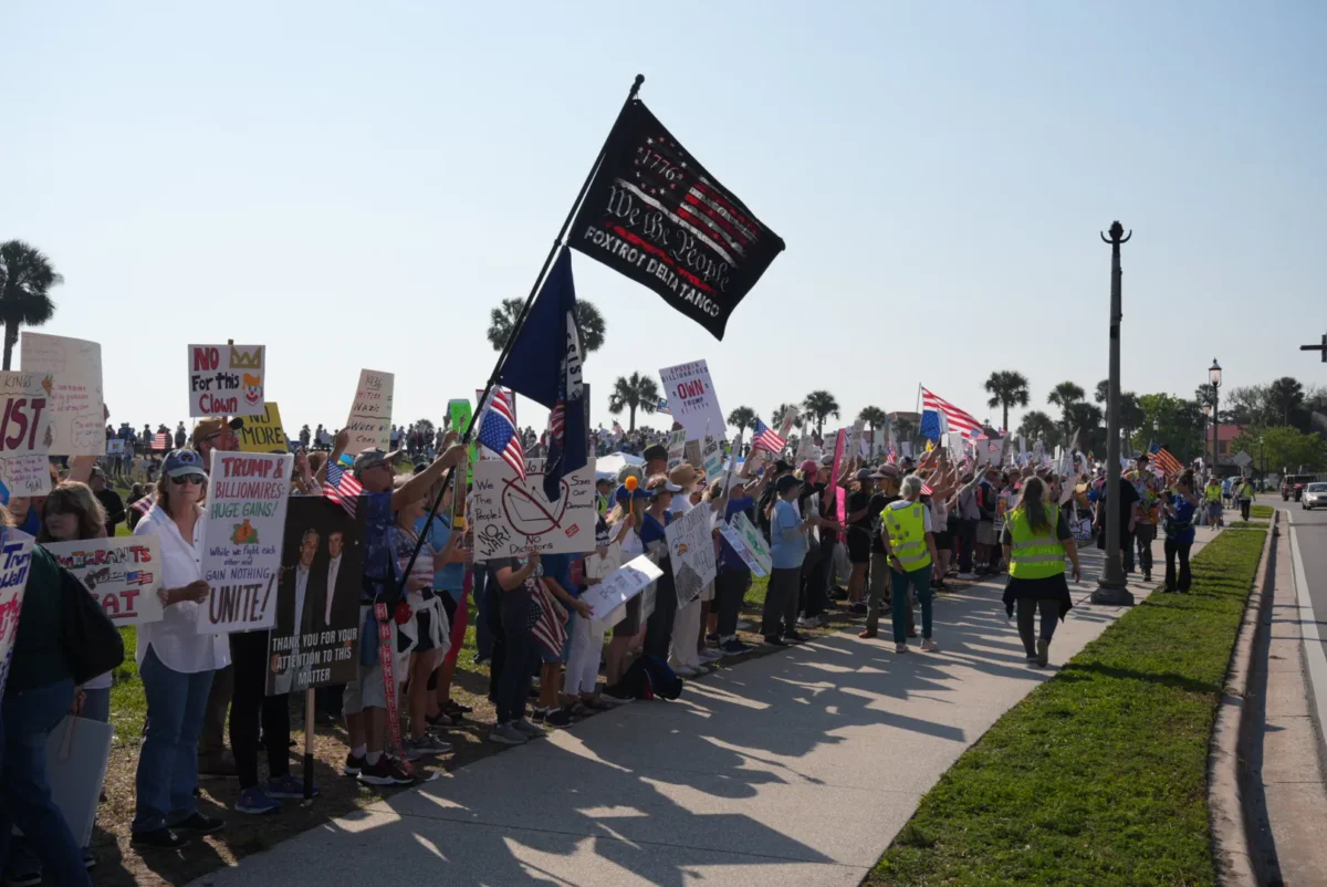 Hundreds line the roadways for a "No Kings" protest opposing President Donald Trump in St. Augustine, Fla., on March 28, 2026. (Troy Myers/The Epoch Times)