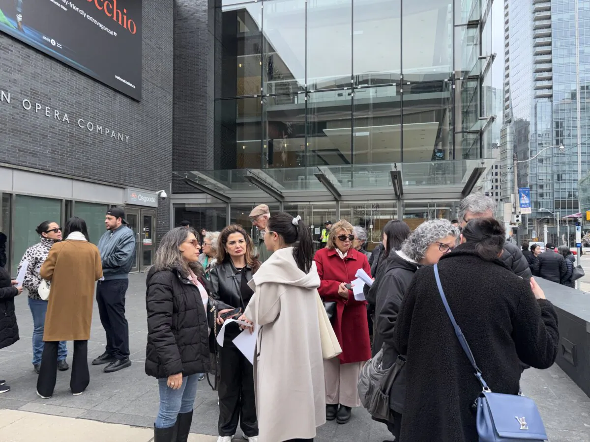 Audience members wait outside the Four Seasons Centre for the Performing Arts in Toronto on April 1, 2026. The theatre decided to cancel Shen Yun's performances over a bomb threat that the police said was unfounded. (Teng Dongyu/The Epoch Times)