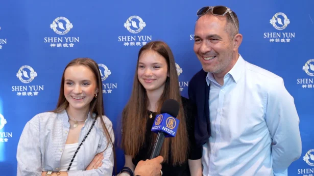 Franck Ougier, a business owner, attends Shen Yun in Lyon with his daughters on April 7, 2026. (NTD)