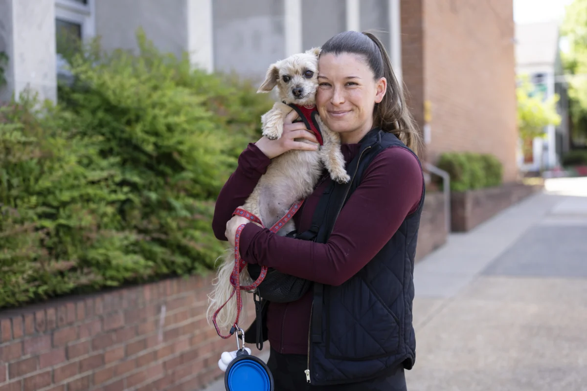 Lara Meehan and her dog Gigi after voting in the redistricting referendum in Alexandria, Va., on April 21, 2026. (Madalina Kilroy/The Epoch Times)