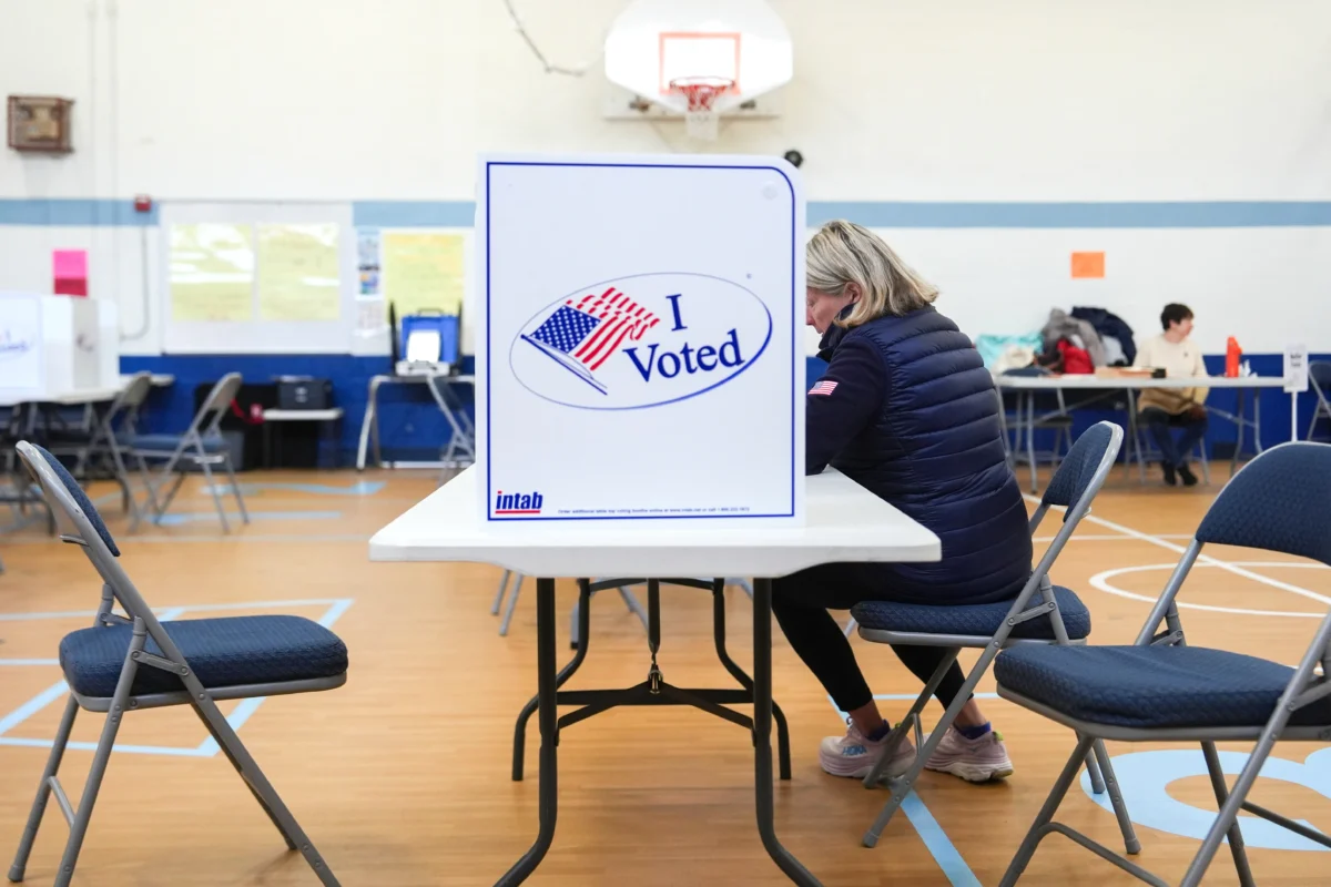 A person votes in the Virginia redistricting referendum at Lyles-Crouch Traditional Academy, Tuesday, April 21, 2026, in Alexandria, Va. (AP Photo/Julia Demaree Nikhinson)