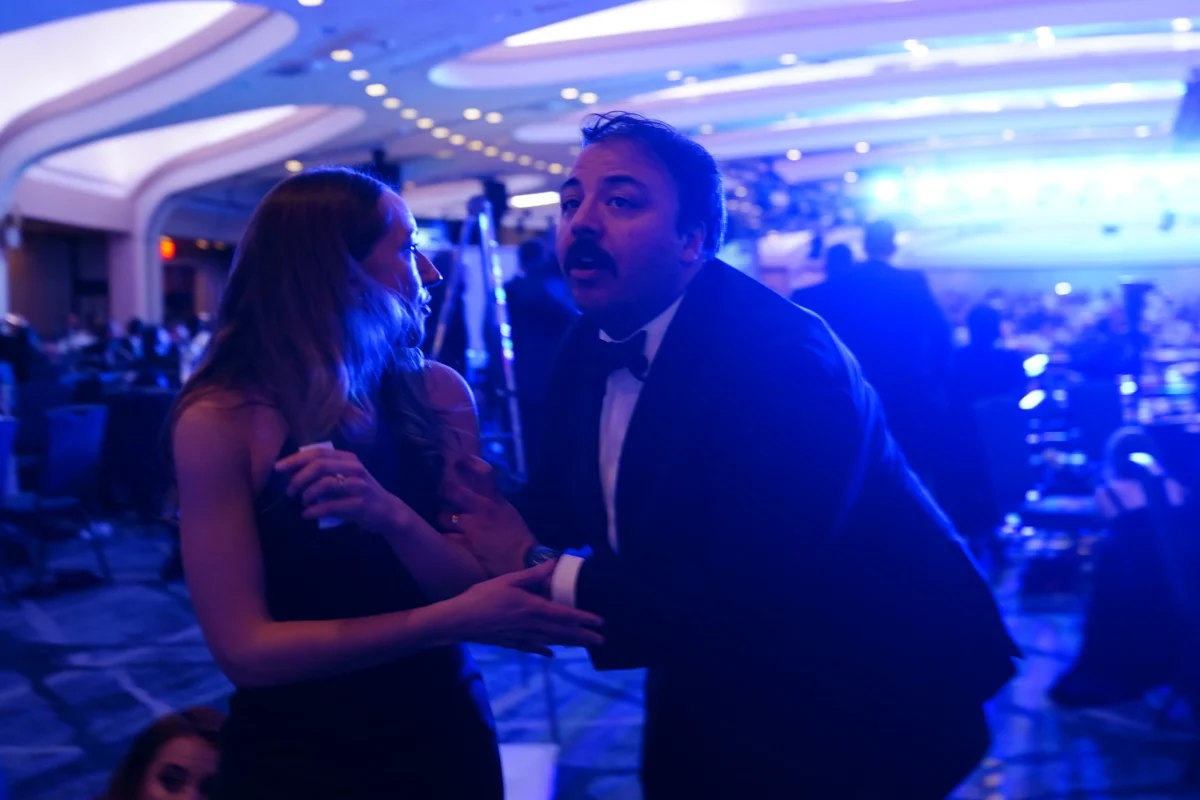 People take cover after an incident at the annual White House Correspondents Association Dinner at the Washington Hilton in Washington on April 25, 2026. (Nathan Howard/Getty Images)